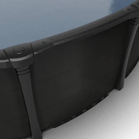 Carvin Sorrento black above-ground pool viewed from above, showing ribbed top rails, connector caps, upright supports, and textured wall panels.