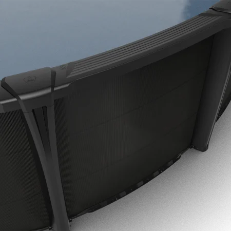 Carvin Sorrento black above-ground pool viewed from above, showing ribbed top rails, connector caps, upright supports, and textured wall panels.
